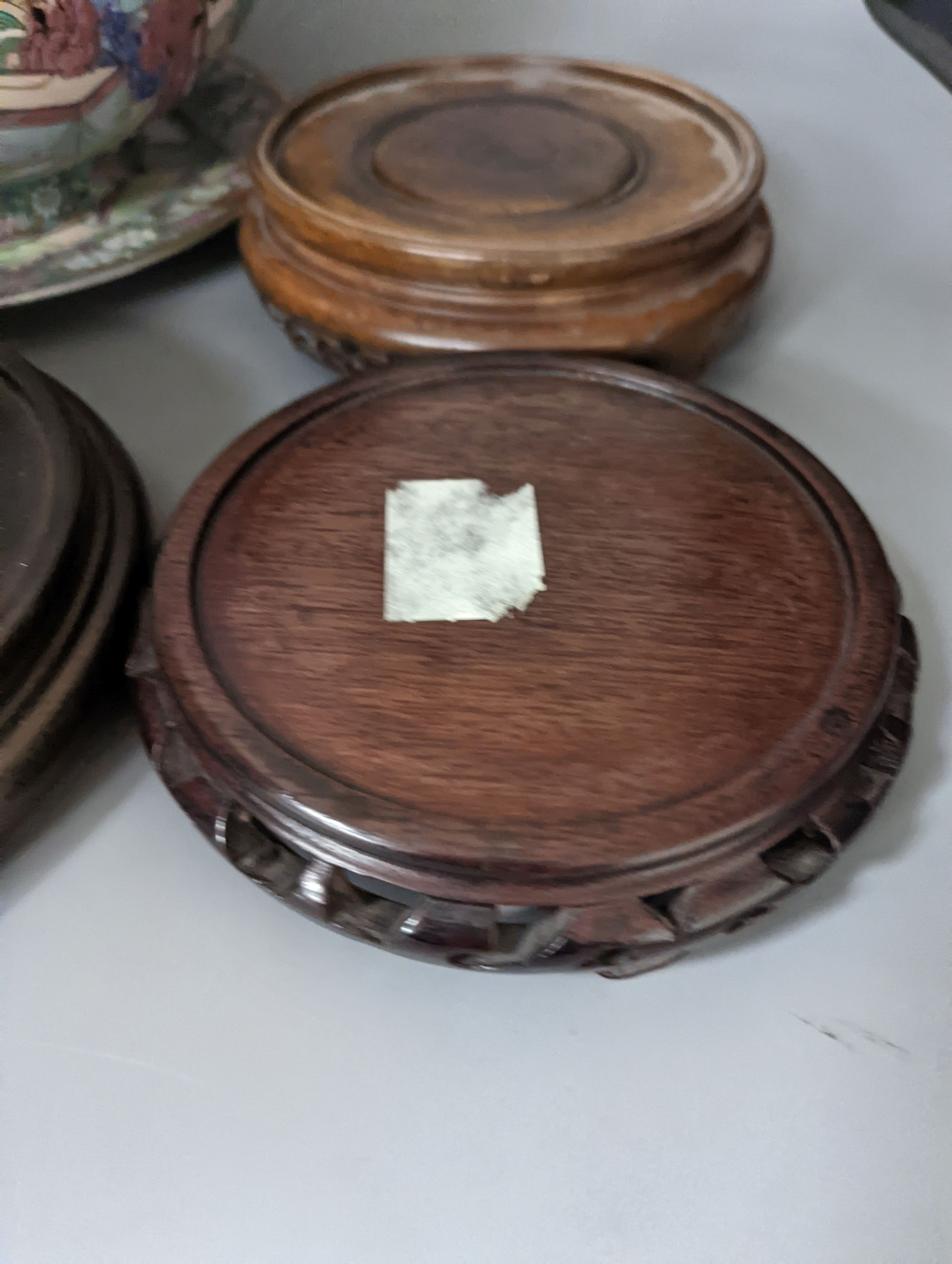 A Chinese famille rose bowl, plate and four stands, bowl 31 cms diameter.